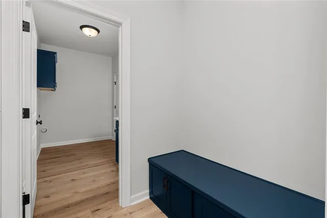 a room that has a dresser in it