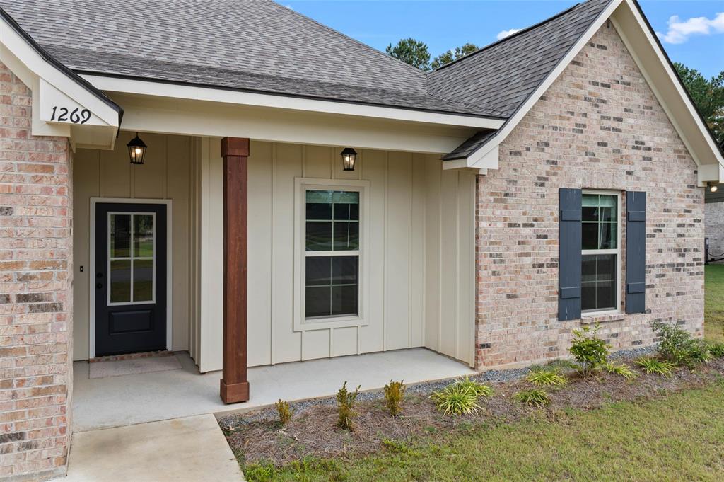 1269 BAYOU BAY Court Frierson, LA 71027 - Photo 7 of 30 a front view of a house with garden