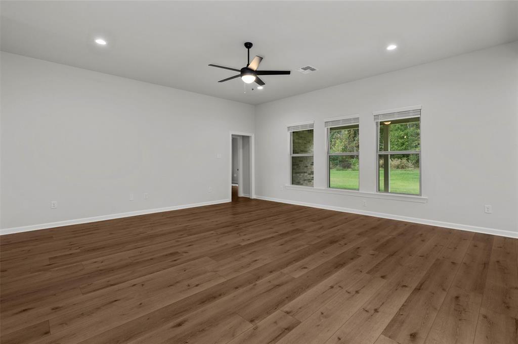 1269 BAYOU BAY Court Frierson, LA 71027 - Photo 8 of 30 a view of an empty room with wooden floor and a window