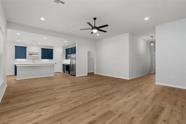 a view of a kitchen with a sink and a kitchen view