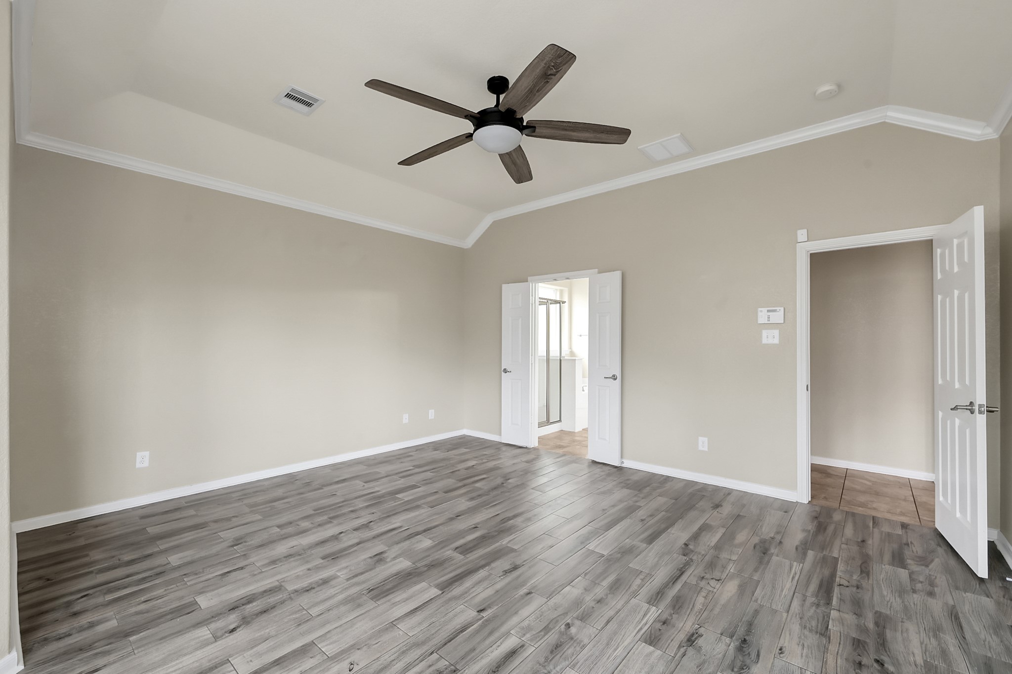 12419 Adams Ridge Lane Humble, TX 77346 - Photo 19 of 46 wooden floor in an empty room with a window