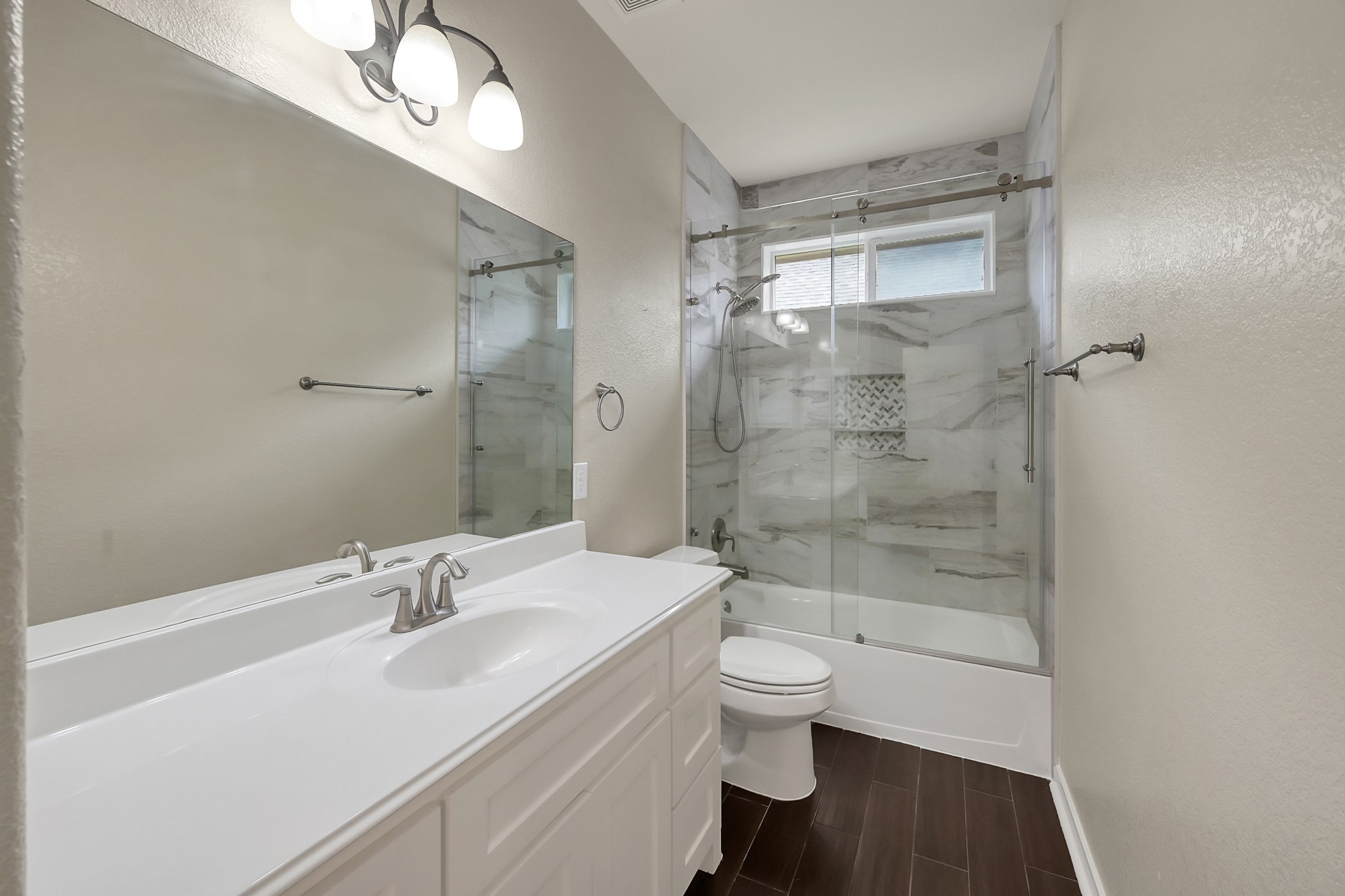 12419 Adams Ridge Lane Humble, TX 77346 - Photo 26 of 46 a bathroom with a sink a toilet and shower