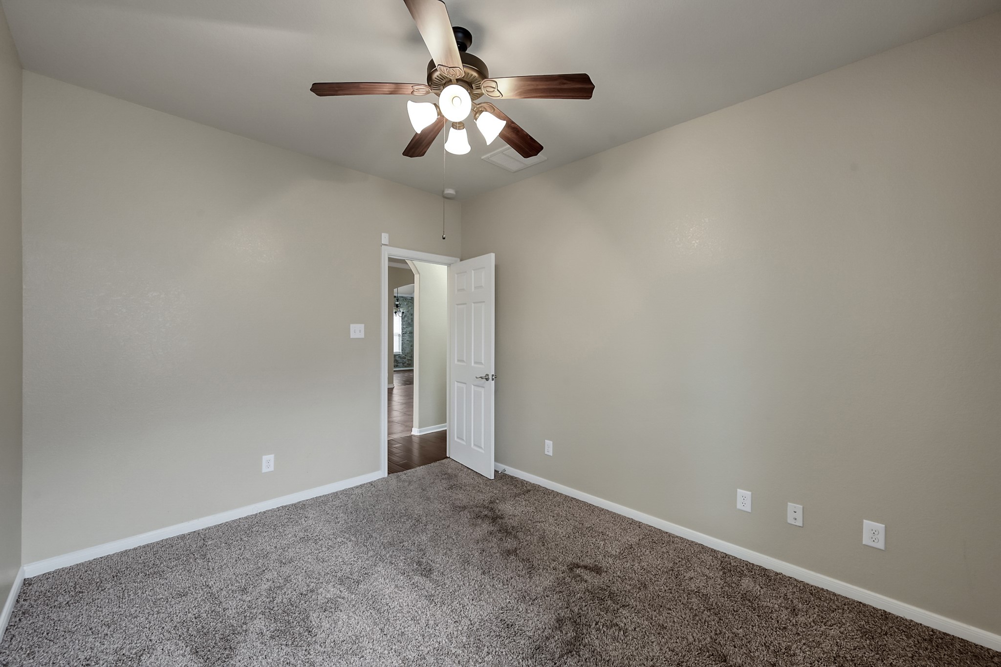 12419 Adams Ridge Lane Humble, TX 77346 - Photo 28 of 46 en empty room with a chandelier fan and a chandelier fan