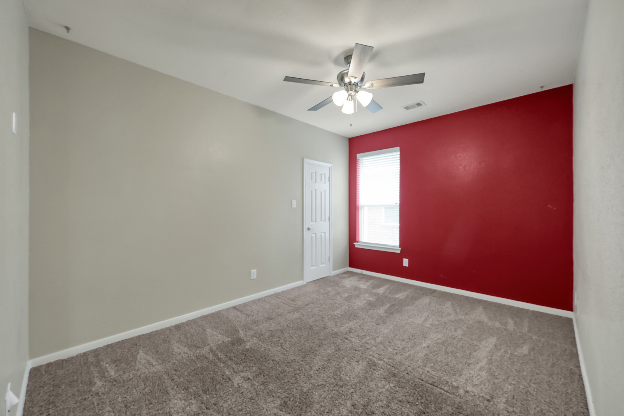 12419 Adams Ridge Lane Humble, TX 77346 - Photo 29 of 46 an empty room with windows and fan