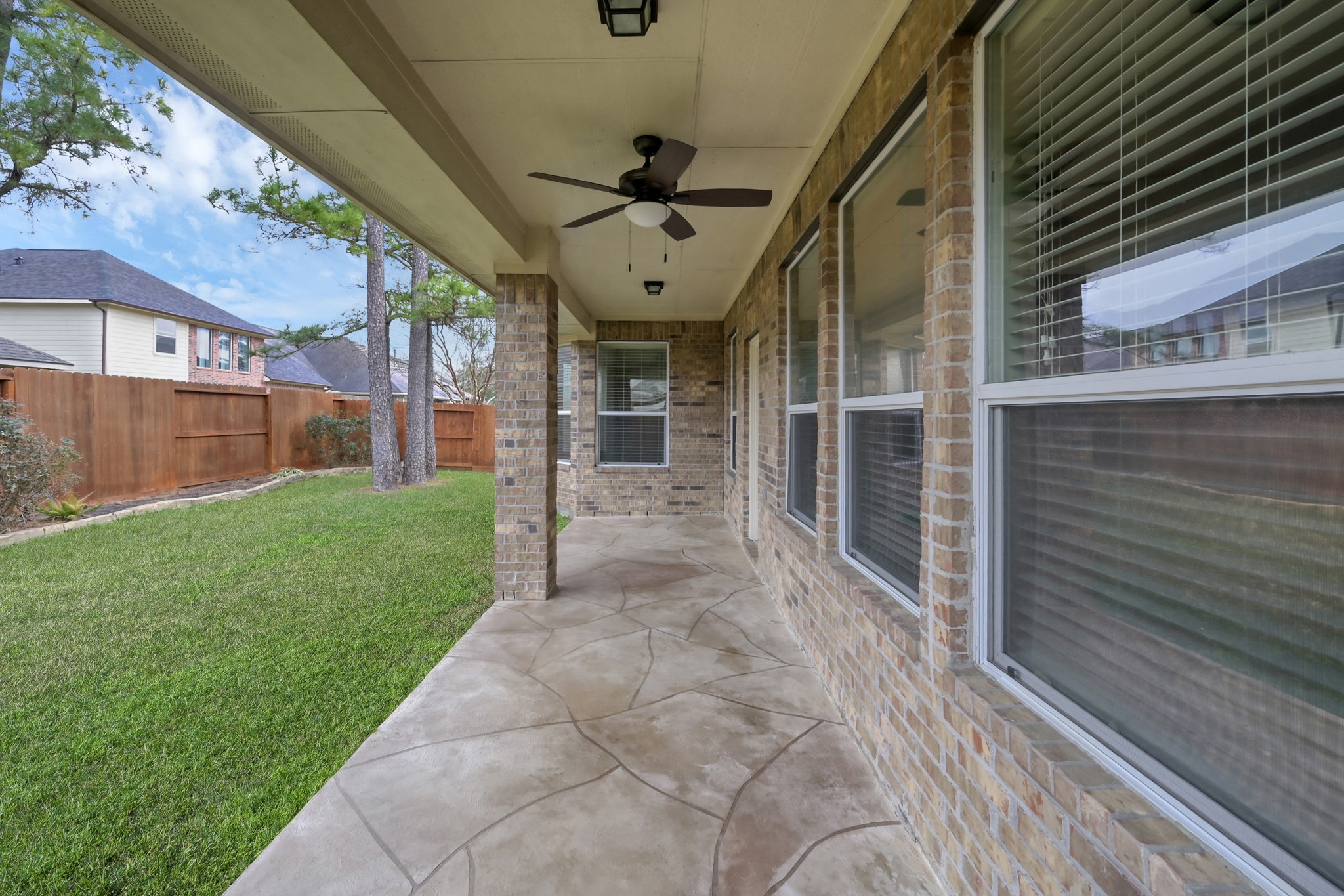 12419 Adams Ridge Lane Humble, TX 77346 - Photo 33 of 46 a view of a porch with a backyard