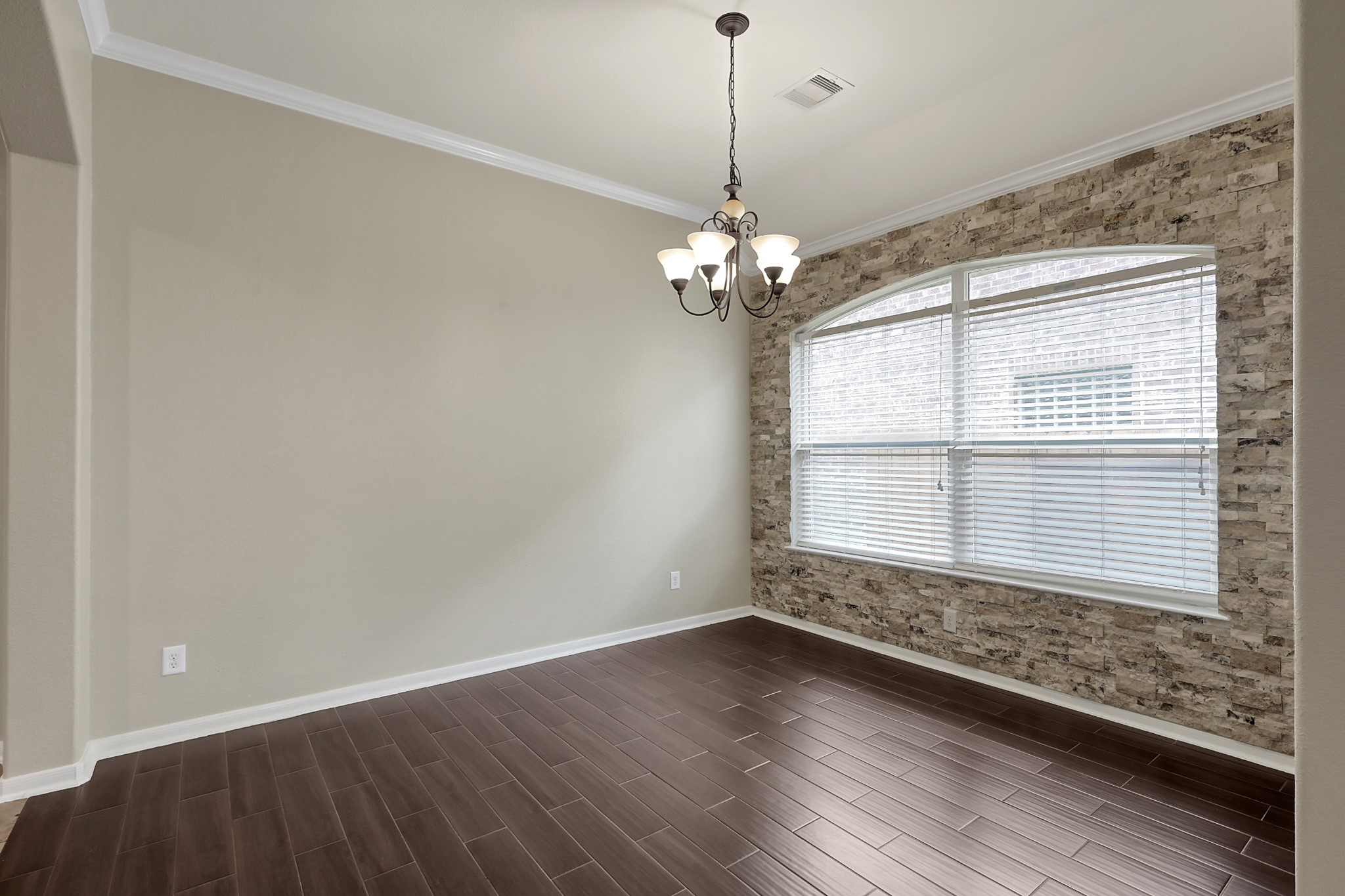 12419 Adams Ridge Lane Humble, TX 77346 - Photo 9 of 46 a view of wooden floor and windows in a room