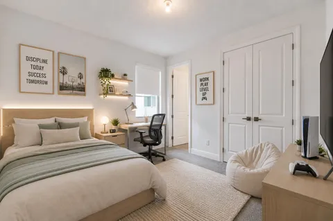 a bedroom with a bed and a couch