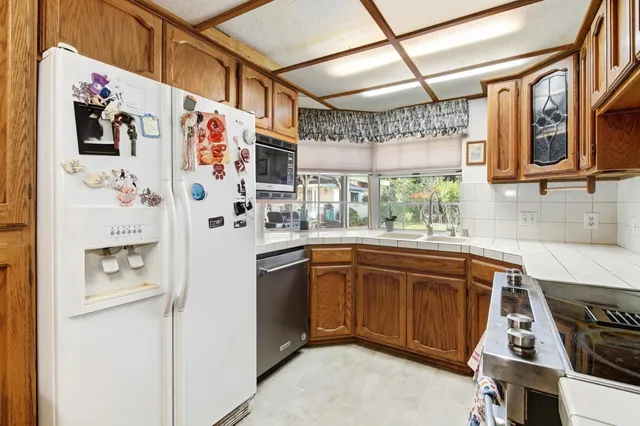 a view of a dining room with furniture and a window