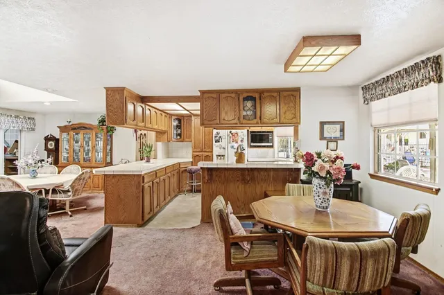 a view of walk in closet with clothes