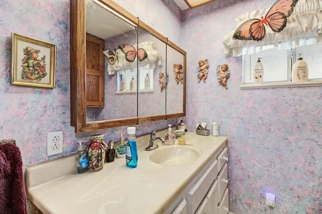 a living room with furniture and a piano