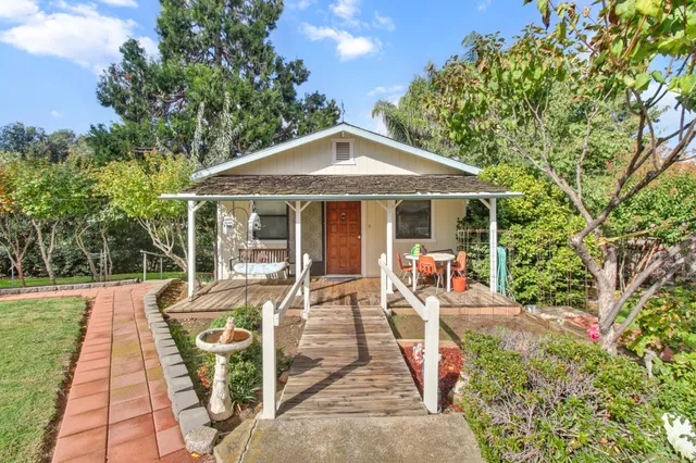 a living room with furniture and flat screen tv