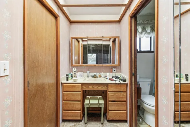 an aerial view of a house with a yard and garden