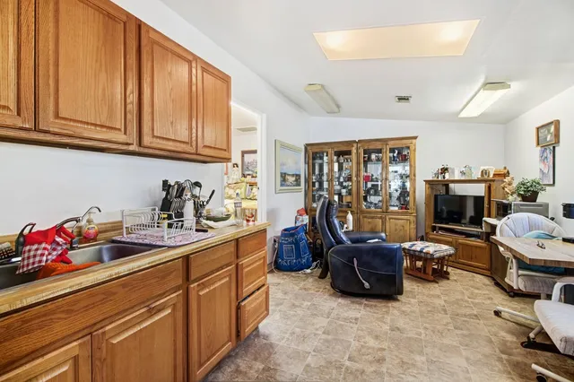 an aerial view of residential houses with outdoor space and street view