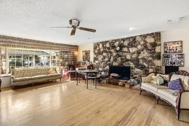 a view of a livingroom with furniture and a flat screen tv
