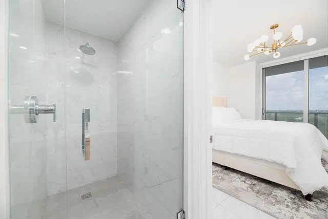 a large white room with a chandelier