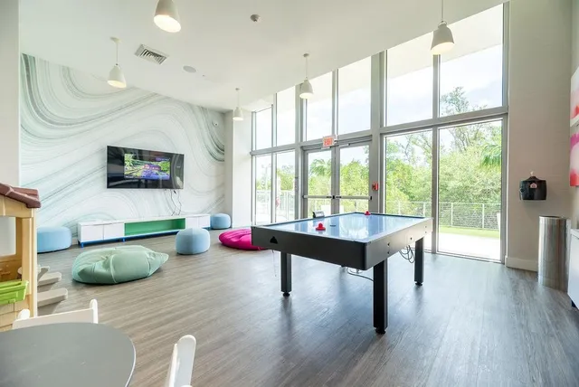 a view of game room with window and couch