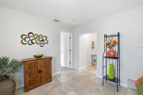 a view of an entryway with wooden floor