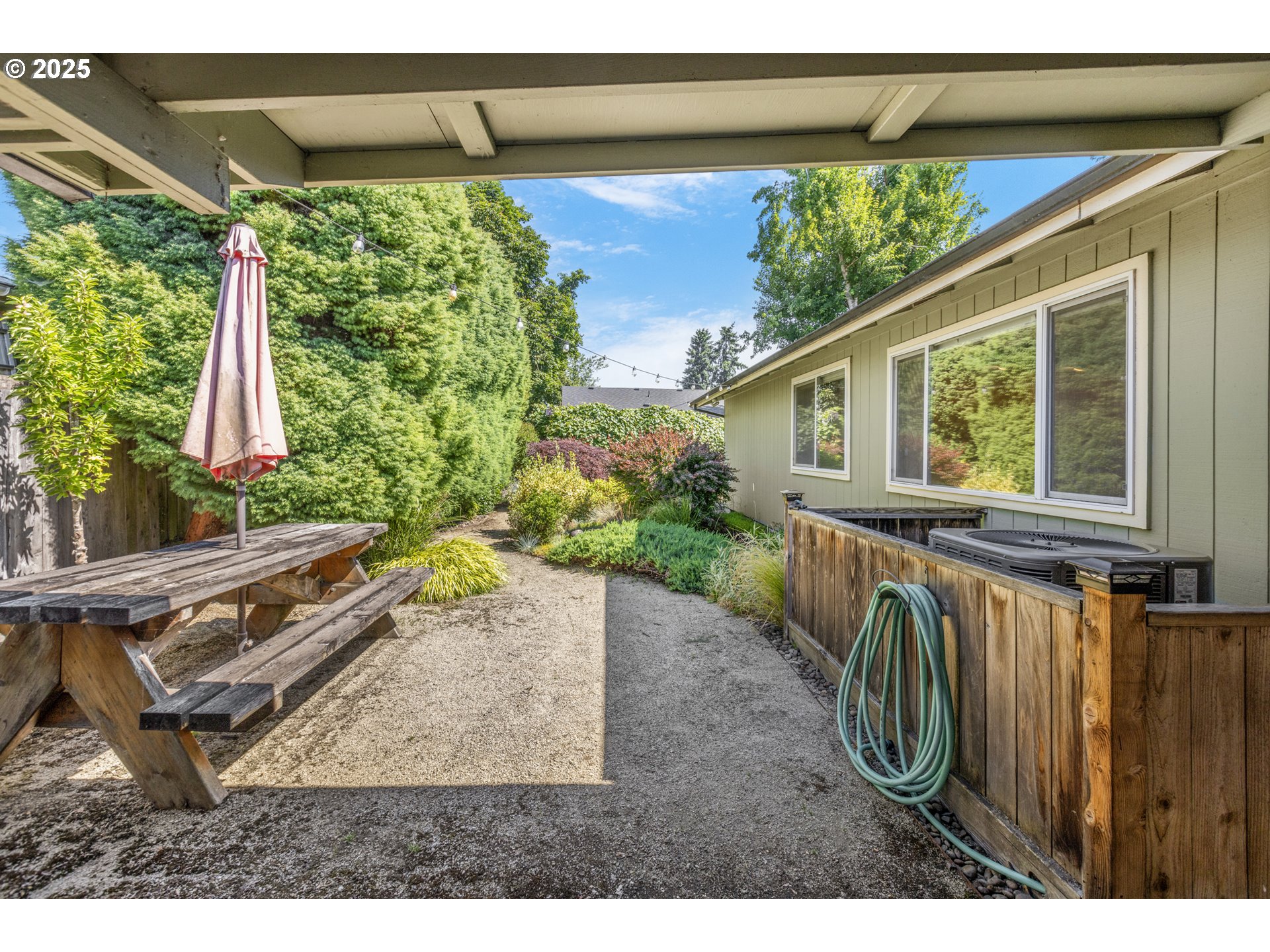 376 49th State Loop Springfield, OR 97478 - Photo 35 of 48 a view of a backyard with potted plants