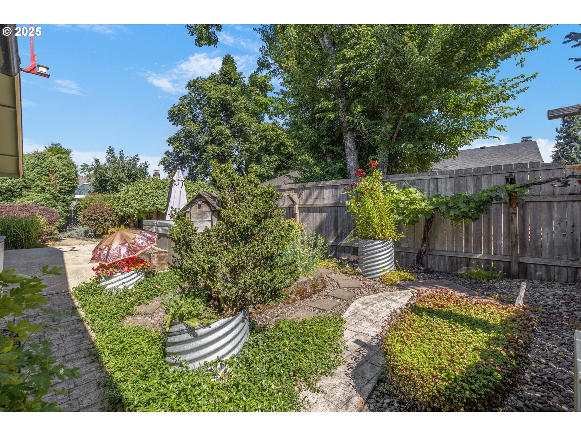 376 49th State Loop Springfield, OR 97478 - Photo 40 of 48 a view of a backyard with plants and a garden