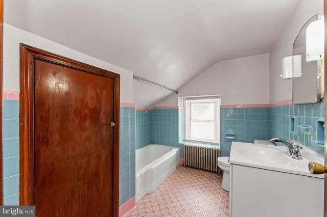 a bathroom with a sink a bath tub and a shower