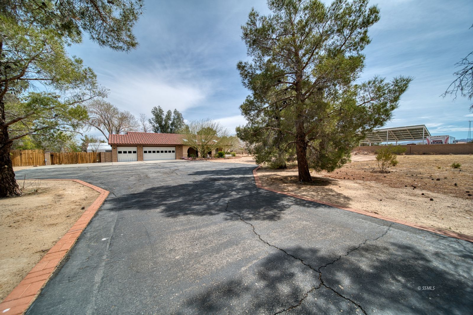 1657 Autumn Avenue Ridgecrest, CA 93555 - Photo 4 of 36 a view of road with large trees