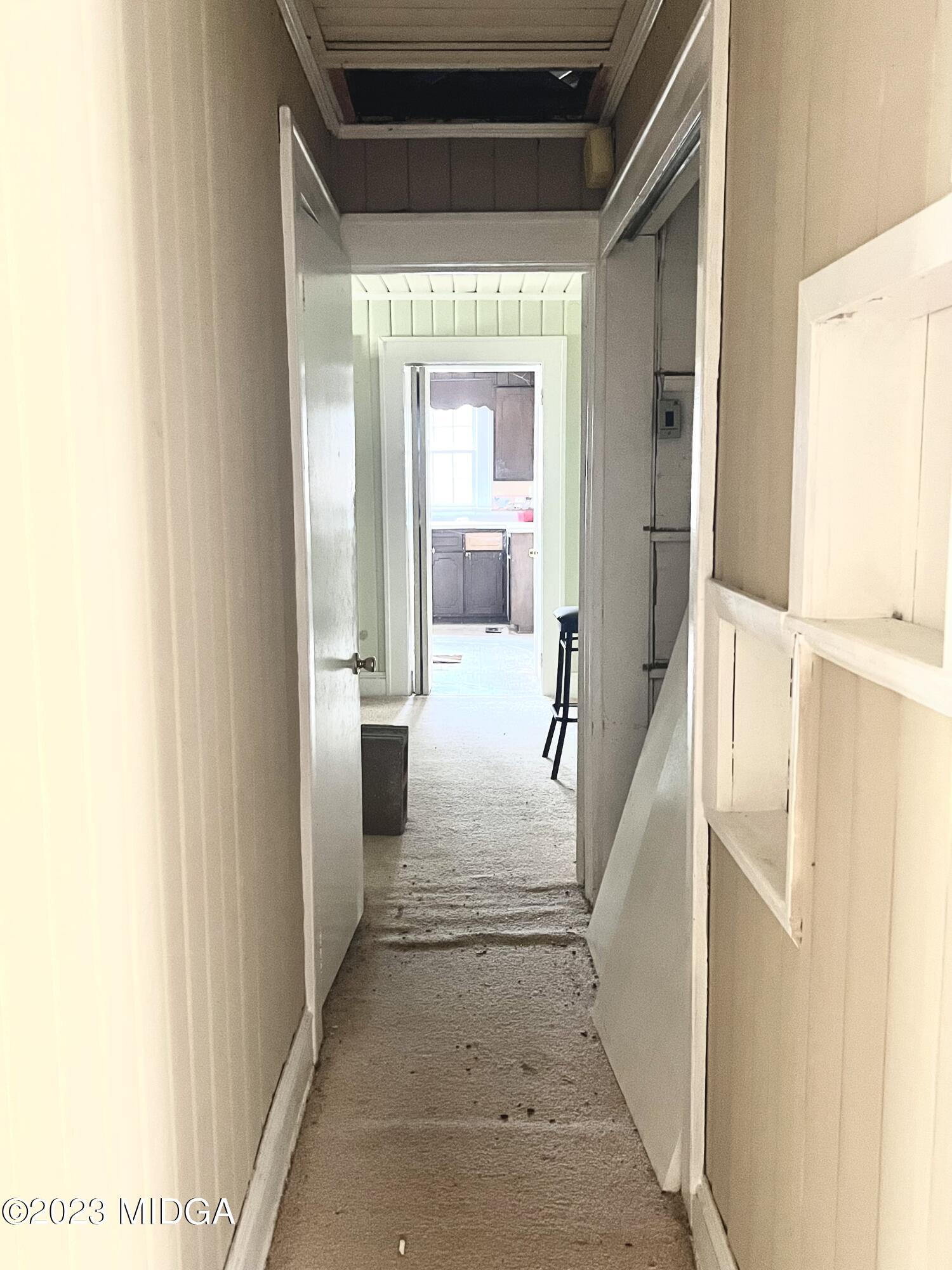 7615 Columbus Road Lizella, GA 31052 - Photo 14 of 56 a view of a hallway with furniture and front door