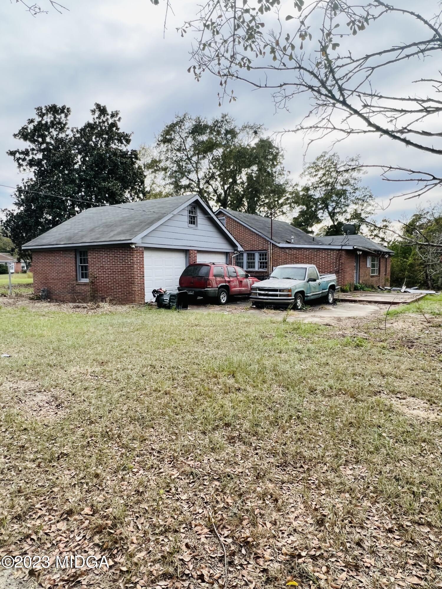 7615 Columbus Road Lizella, GA 31052 - Photo 21 of 56 a view of a house with a yard and sitting area