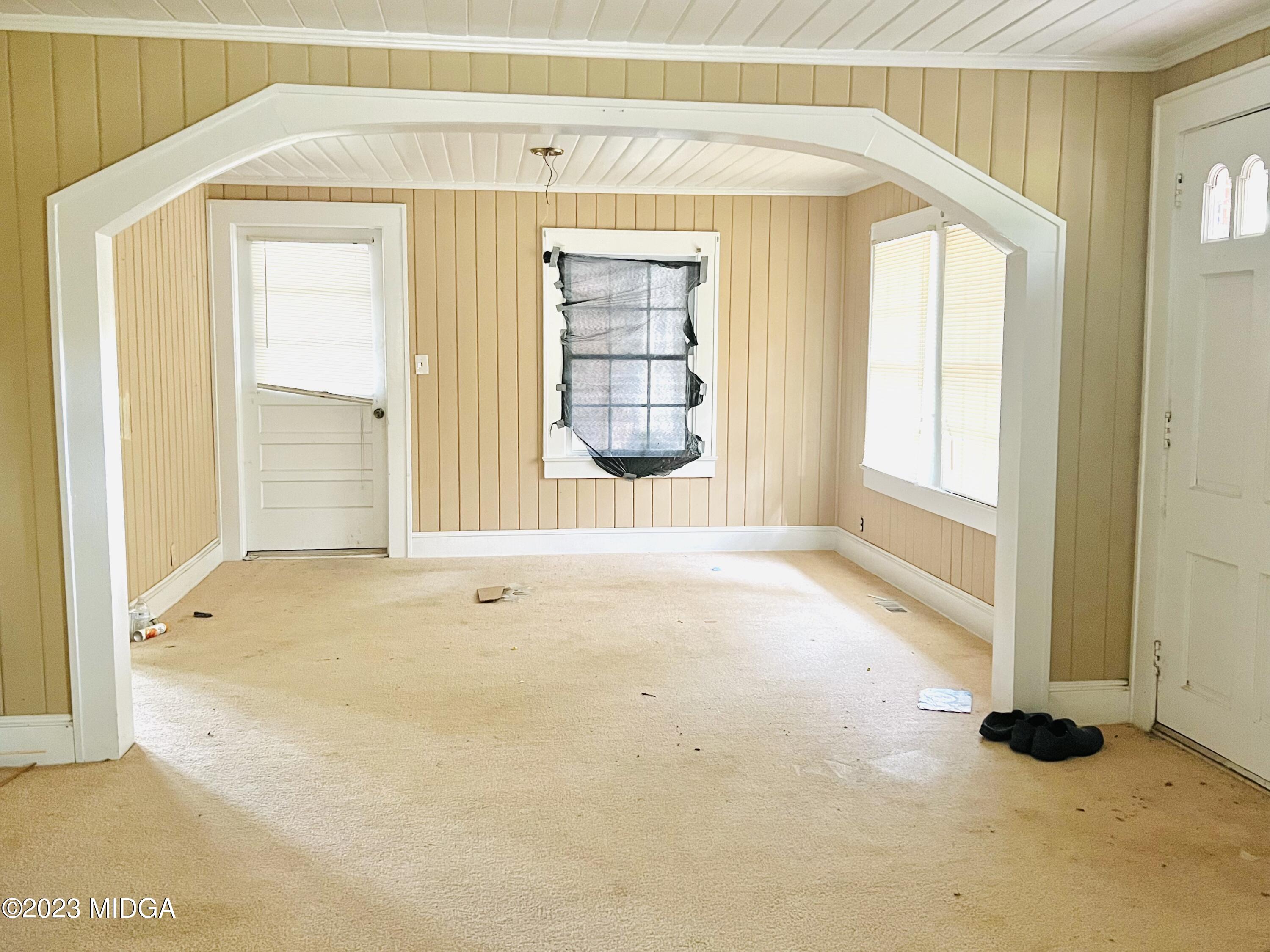 7615 Columbus Road Lizella, GA 31052 - Photo 6 of 56 a view of an empty room with a window