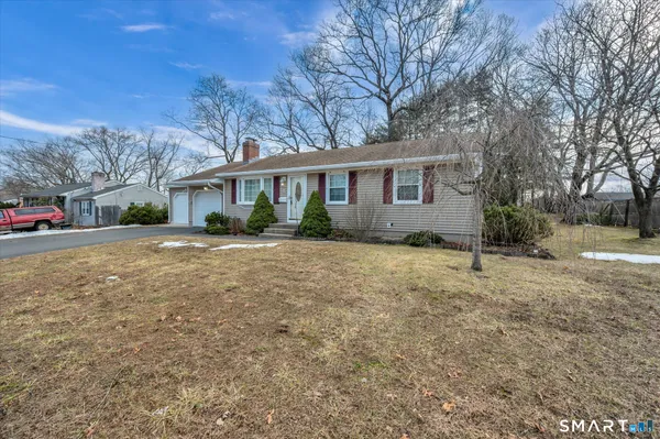 a view of a house with a yard
