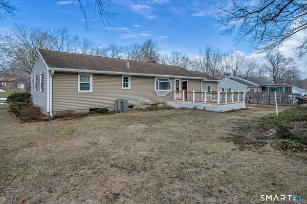 a house with trees in the background