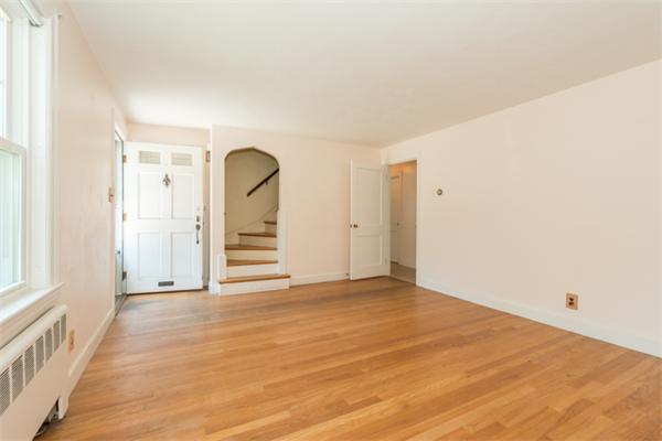 20 Overlook Road Arlington, MA 02474 - Photo 2 of 17 a view of a room with wooden floor and a ceiling fan