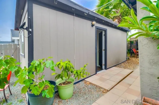 a backyard with potted plants