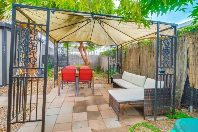 a view of yard with patio