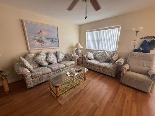 a living room with furniture and a window