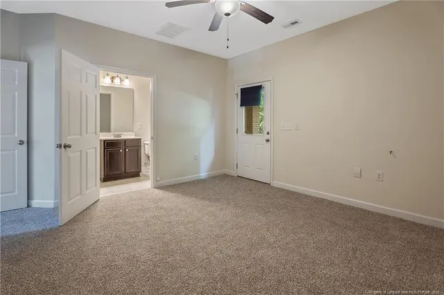 an empty room with a bathroom