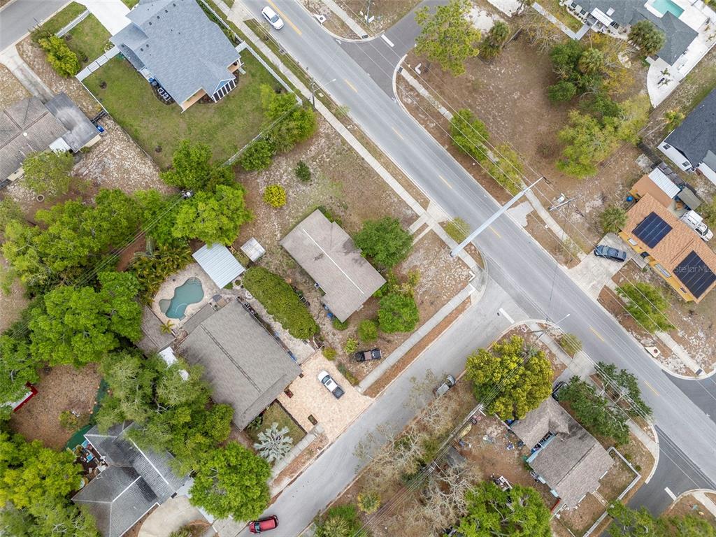 230 Milwaukee Avenue Dunedin, FL 34698 - Photo 14 of 61 an aerial view of a house with a garden