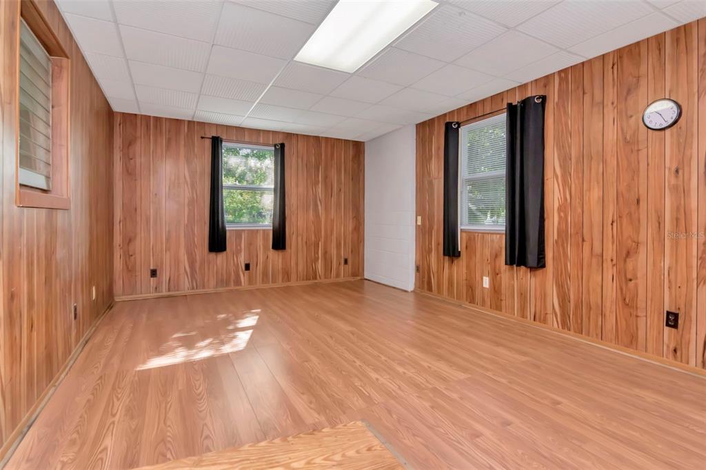 230 Milwaukee Avenue Dunedin, FL 34698 - Photo 19 of 61 a view of a livingroom with wooden floor and windows