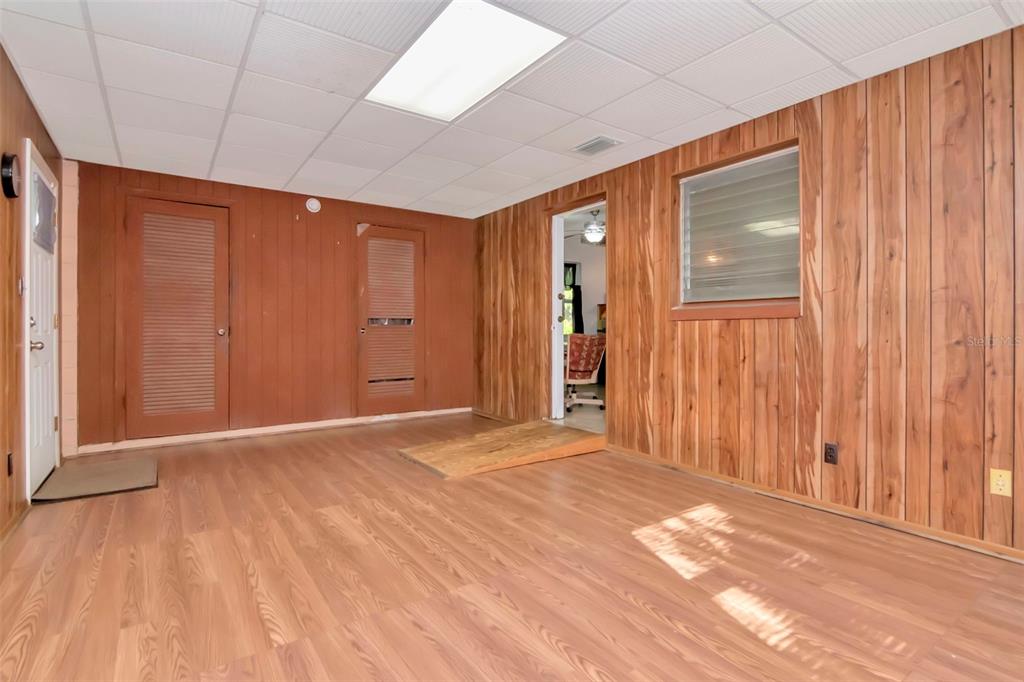 230 Milwaukee Avenue Dunedin, FL 34698 - Photo 22 of 61 a view of an empty room with wooden floor