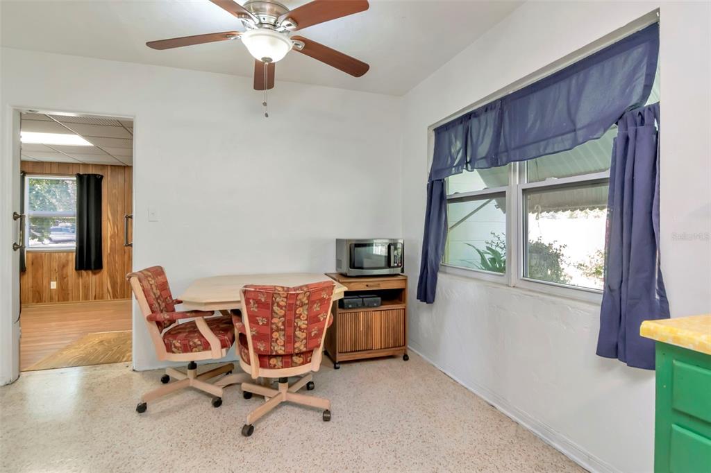 230 Milwaukee Avenue Dunedin, FL 34698 - Photo 24 of 61 a view of workspace with furniture and a window