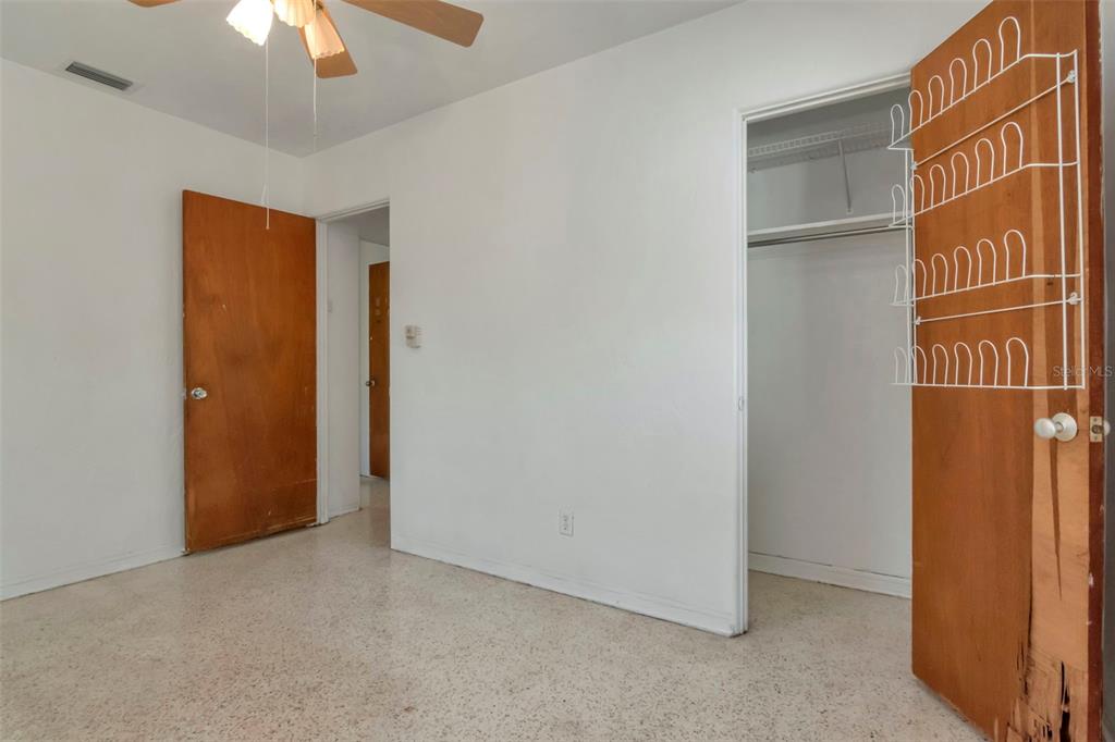 230 Milwaukee Avenue Dunedin, FL 34698 - Photo 34 of 61 a view of empty room with a ceiling fan