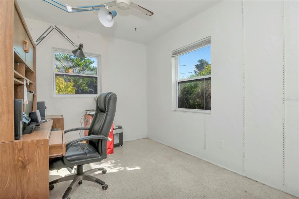 230 Milwaukee Avenue Dunedin, FL 34698 - Photo 36 of 61 a view of a workspace with furniture and a window