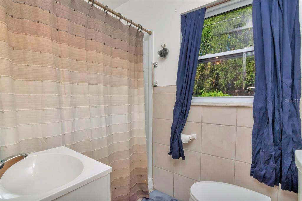 230 Milwaukee Avenue Dunedin, FL 34698 - Photo 38 of 61 a bathroom with a toilet and a shower