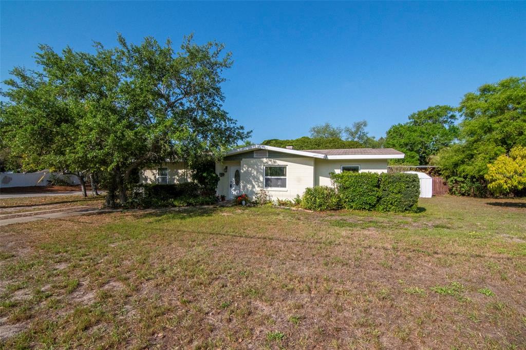 230 Milwaukee Avenue Dunedin, FL 34698 - Photo 51 of 61 a front view of a house with a yard