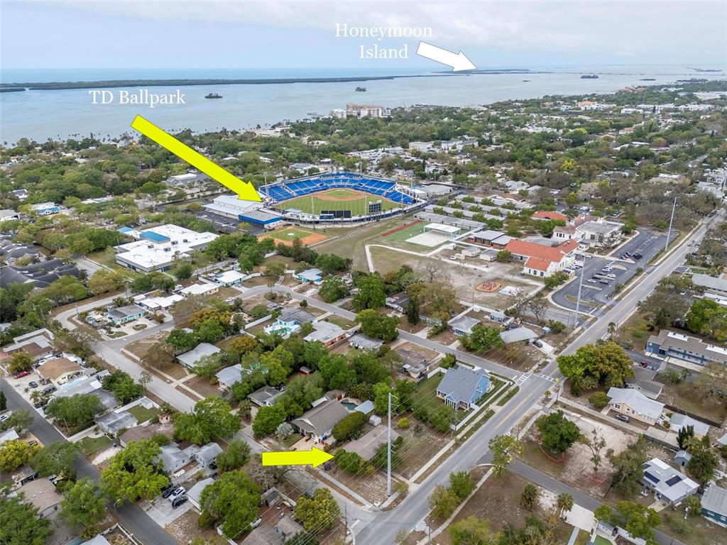 230 Milwaukee Avenue Dunedin, FL 34698 - Photo 6 of 61 an aerial view of residential houses with outdoor space