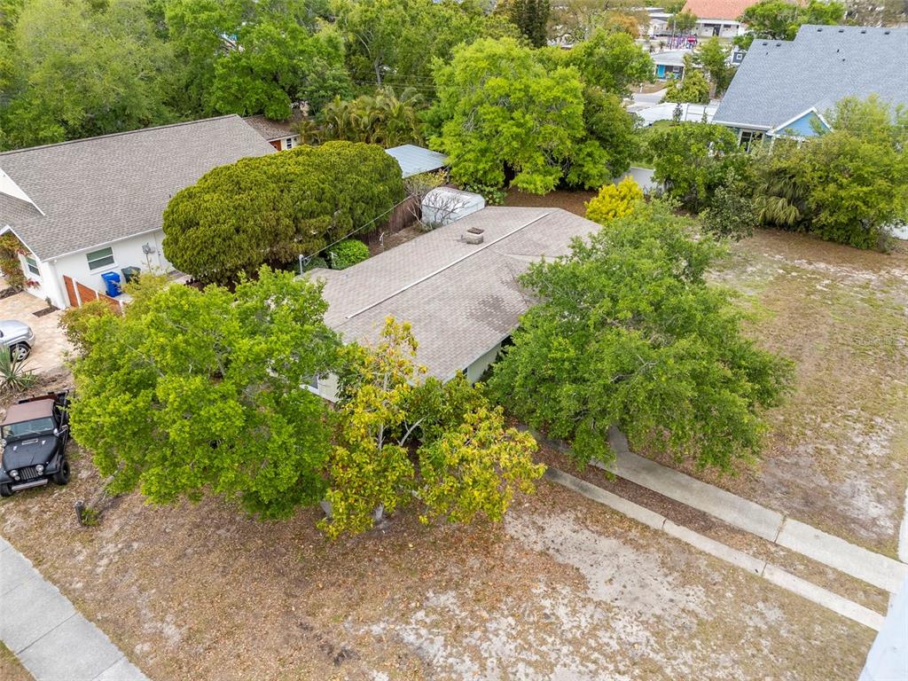 230 Milwaukee Avenue Dunedin, FL 34698 - Photo 61 of 61 an aerial view of a house with a yard and greenery space