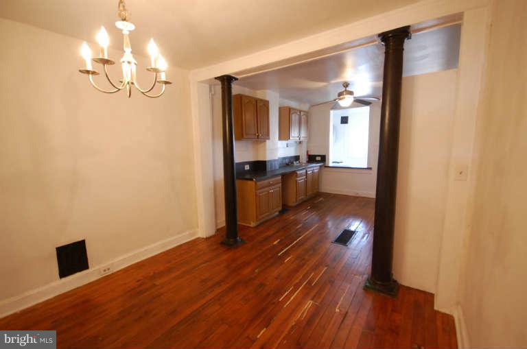 2218 Annapolis Road Baltimore, MD 21230 - Photo 3 of 15 a view of a livingroom with wooden floor
