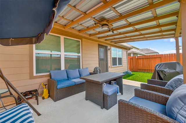 a outdoor living space with furniture and a couch