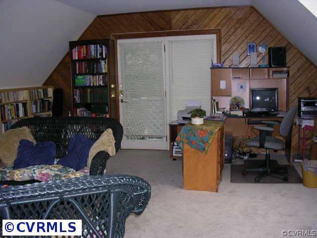 3208 Fortunes Ridge Road Midlothian, VA 23112 - Photo 3 of 10 a room with furniture and a book shelf