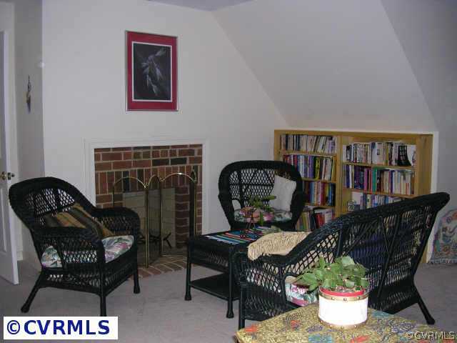 3208 Fortunes Ridge Road Midlothian, VA 23112 - Photo 4 of 10 a living room with furniture a piano and a bookshelf