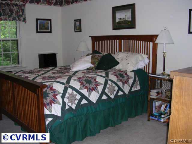 3208 Fortunes Ridge Road Midlothian, VA 23112 - Photo 7 of 10 a bedroom with a bed and a window